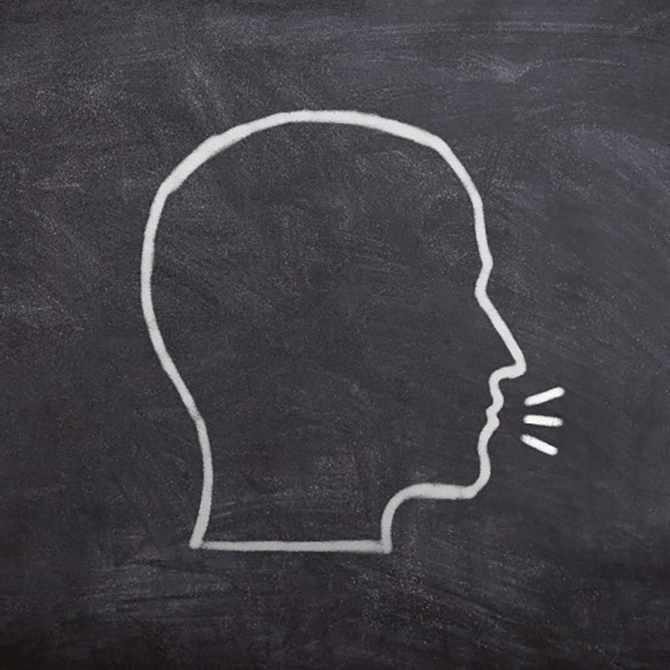 An image of a chalkboard with the outline of a human head, with speech marks, in white chalk