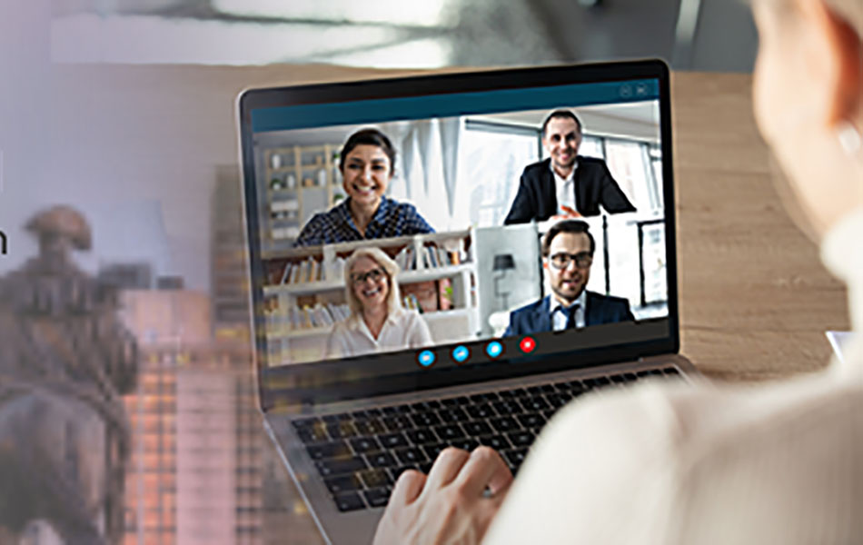 An image of a person using a laptop on which four people are taking part in a video call