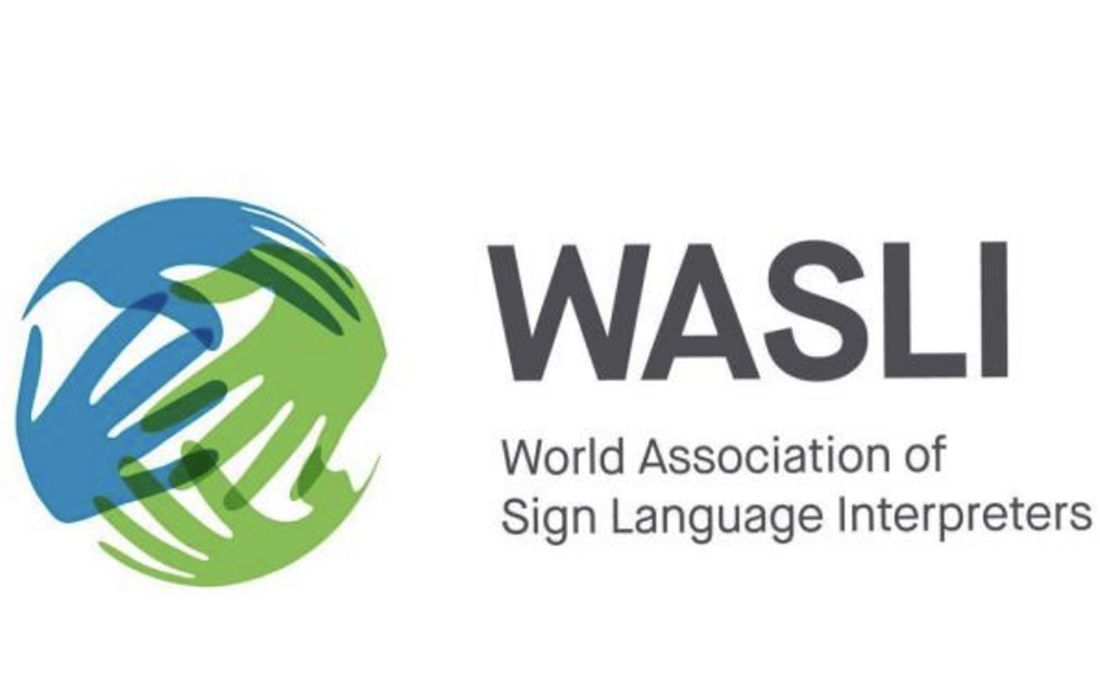 An illustration of blue and green hands touching in a globe