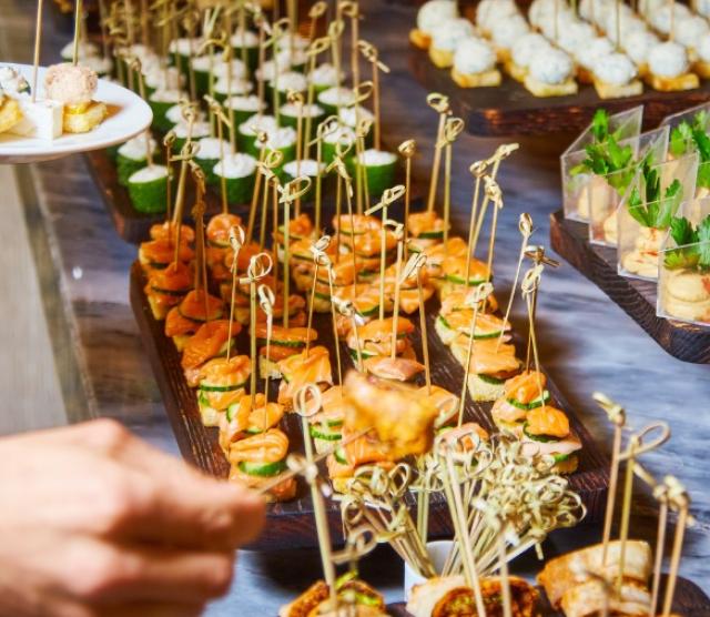 Table laid out with canapes for a reception.
