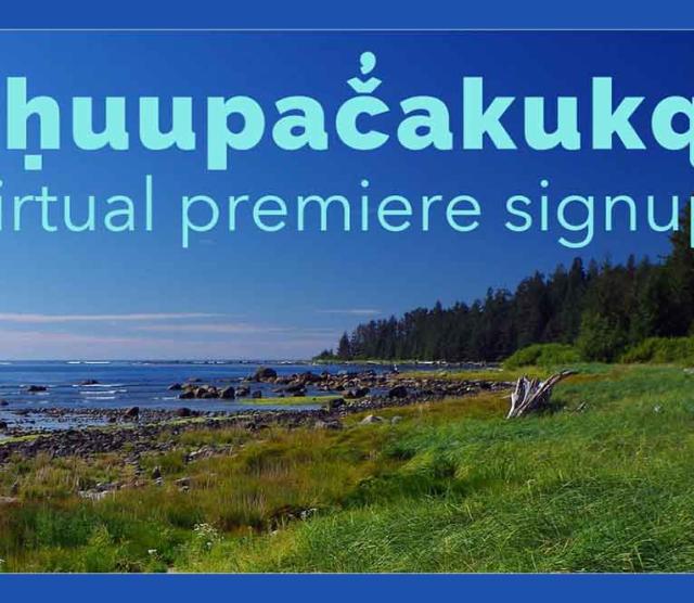 An image of a seashore with green grass dotted with rocks running to the sea