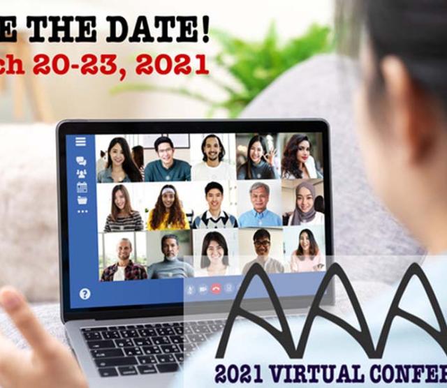 An image of the back of someones head as they speak to a number of people virtually on a laptop