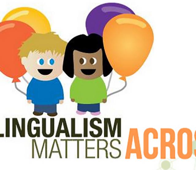 Two cartoon children holding colourful balloons