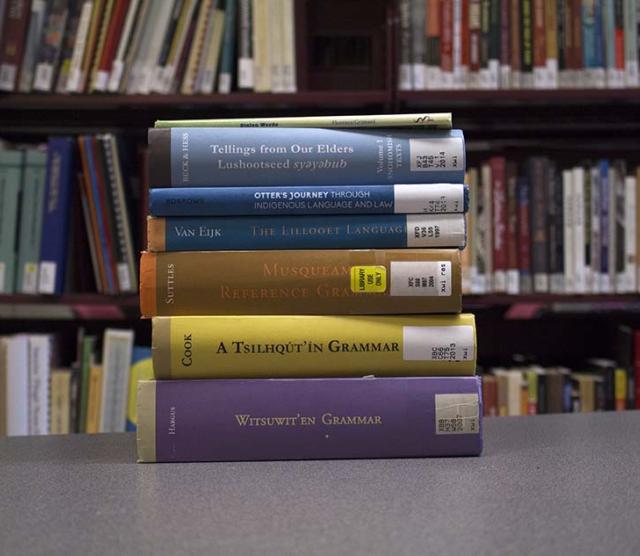 A picture of some of the books in UBC Press’ First Nations Language Series, available at Xwi7xwa Library