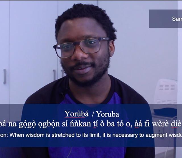 A screenshot of Samuel Akinbo saying his favourite phrase in Yoruba. The phrase is displayed in white across the bottom of the image
