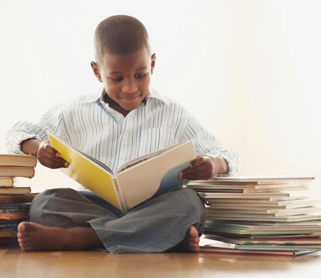 A young child reading a book