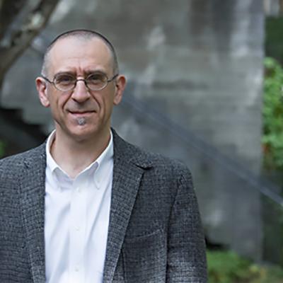 A headshot of Valter Ciocca standing outside