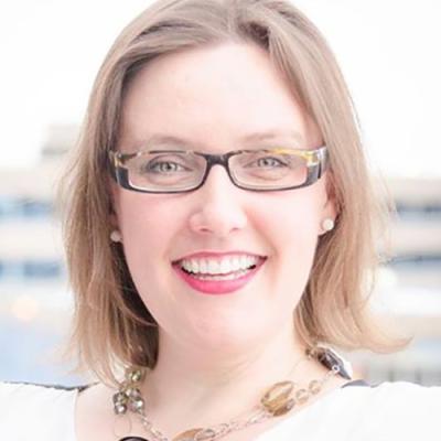 A headshot of Dr Demmans Epp smiling and wearing glasses.