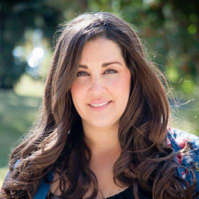 A headshot of Dr. Anusha Kassan standing outside