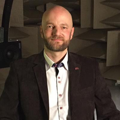 A photo of Jérémie Voix sitting in a workshop