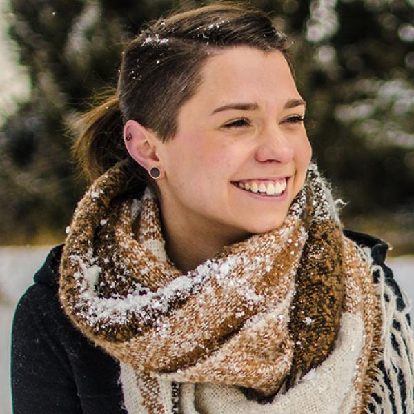 A headshot of Nathalie Czeke sitting outside in the snow