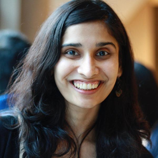 A headshot of Varada Kolhatkar inside a building